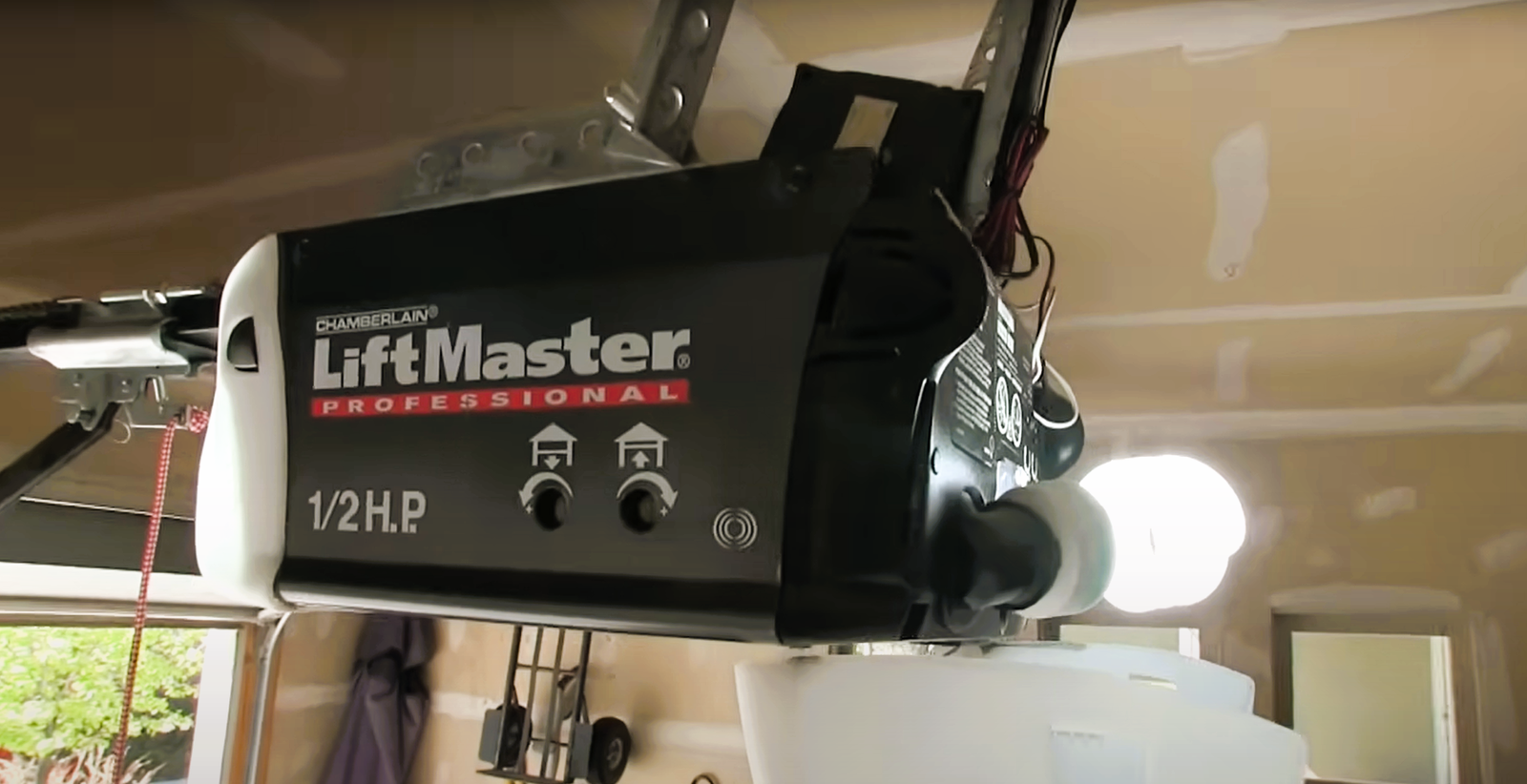 Technician performing garage door opener installation in Bradenton, Florida.