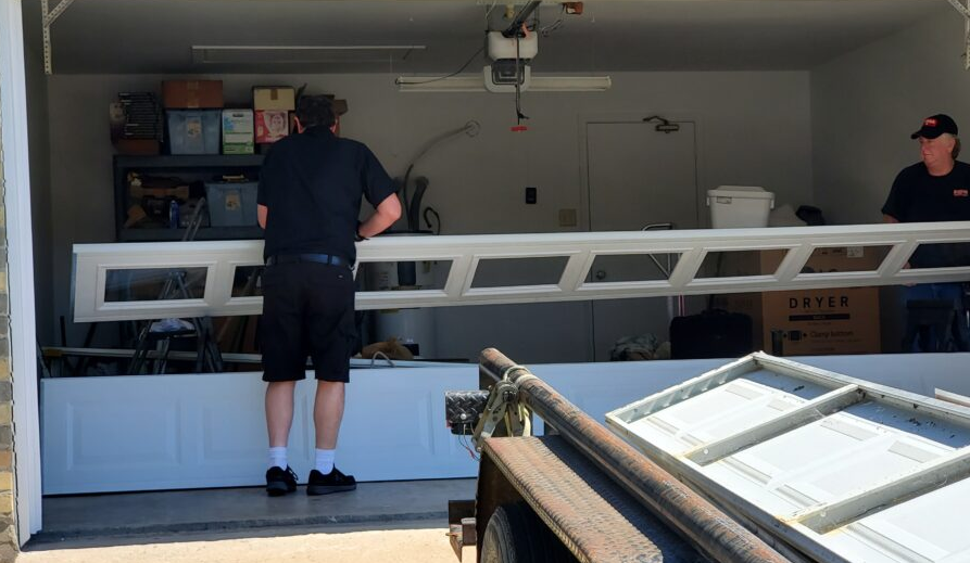 Technician performing garage door panel repair in Bradenton, Florida