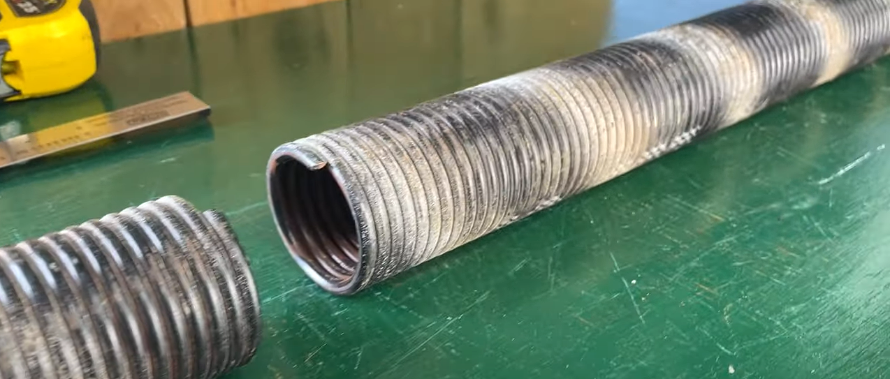 a professional technician performing garage door spring repair in Bradenton, Florida, showcasing the repair process with tools in hand against a background of a residential garage, enhancing the safety and functionality of the door.