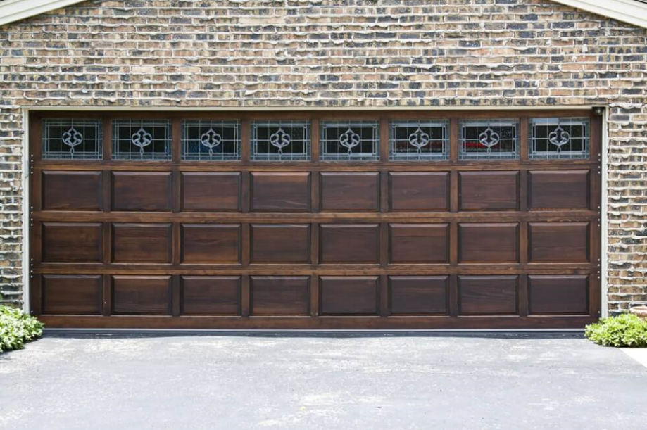 Professional garage door repair service in Bradenton, Florida, showcasing efficient technicians repairing a garage door spring to ensure smooth operation.