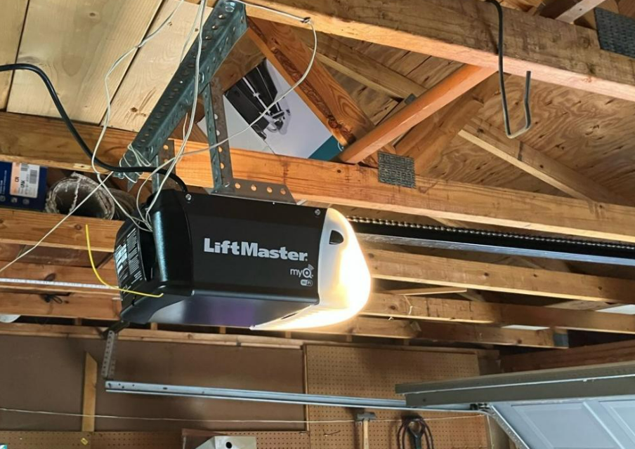 Technician performing garage door opener repair in Bradenton, Florida