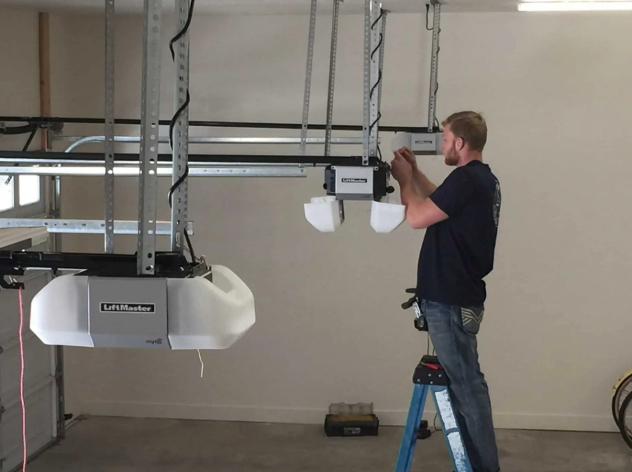 Technician repairing a garage door opener in Bradenton, Florida - Expert garage door opener repair services