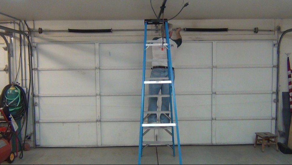 Professional garage door repair services in Bradenton, Florida, showcasing technicians fixing a residential garage door